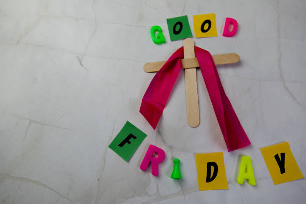 Good Friday day text and wooden cross white background with copy space for text