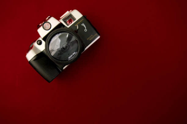 istock Vintage film camera on red background Top view with copy space 2148620916