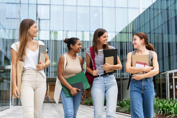 istock Cheerful multiracial student girls walking after university classes - Diversity in Higher Education 2148621394