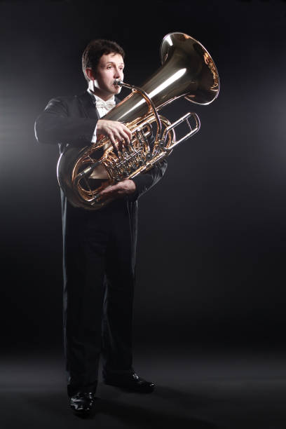 istock Tuba player brass instrument. Classical musician man playing euphonium 2148622382