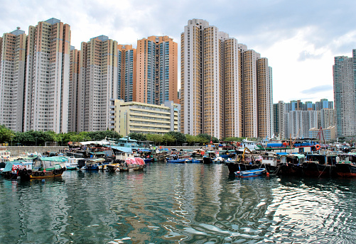 The Aberdeen Floating Village is situated in the Southern District of Hong Kong, specifically at the Aberdeen Harbor. Since the 19th century, it was one of the most important fishing ports in Hong Kong, but during the 1990s and 2000s, the village’s population began to decrease. The photograph that you are looking at shows just a small segment of Aberdeen Floating Village during September of 2010. It’s a close and somewhat intimate look into the daily life of this unique place.