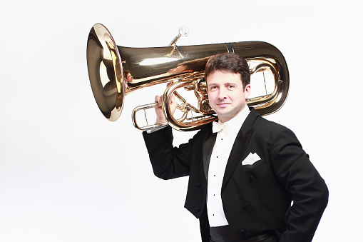 Tuba player brass instrument. Classical musician portrait with euphonium