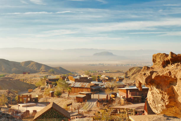 View of the former silver mining town, now a ghost town, of Calico and the San Bernardino Valley in the Mojave Desert, California, USA. View of the former silver mining town, now a ghost town, of Calico and the San Bernardino Valley in the Mojave Desert, California, USA. calico ghost town california stock pictures, royalty-free photos & images