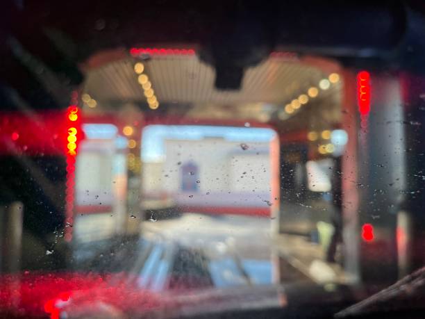 istock Car Wash with water droplets, blurry image and red lights. 2148626876