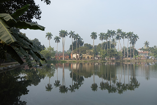 Beautiful reflection at Puthia Rajbari Lake landscape historical site in Puthia Bangladesh