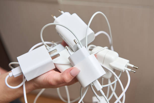 istock Lots of chargers in hand for devices 2148627700