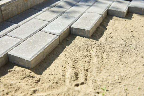 istock Creating a sidewalk in a garden made of tiles 2148627846