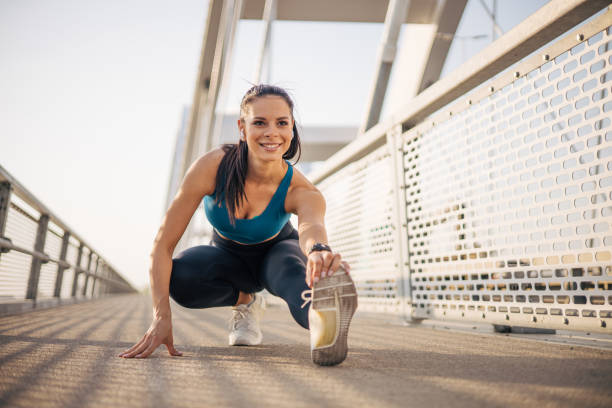 istock Beautiful attractive athlete warming up and preparing for running. 2148633357