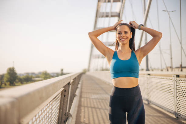 istock Attractive young sportswoman ties her tail. 2148634345