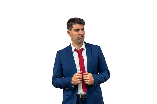 perplexed expression of a businessman as he looks to the side while holding his suit, displaying confusion and uncertainty. Dressed in corporate attire, his puzzled expression reflects surprise white background