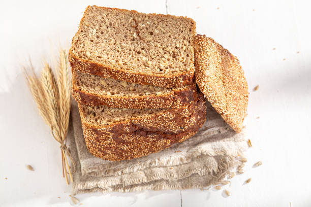 istock Square loaf of rye bread baked in a rustic kitchen. 2148636940