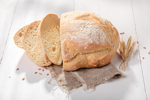 Tasty and homemade round loaf bread baked with yeast and flour. Homemade bread.