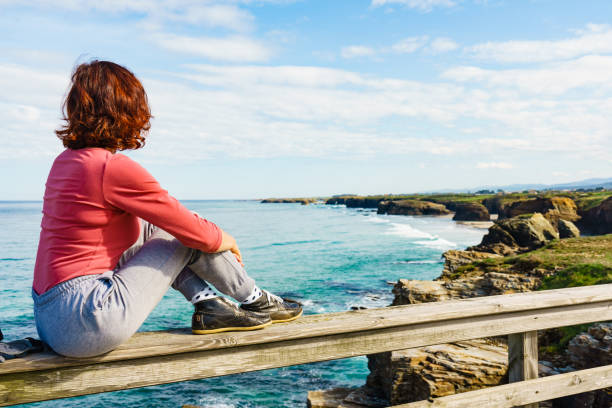 istock Woman visiting Cathedral Beach in Spain. 2148637990
