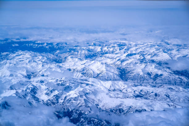 Top view of mountains with snow and clouds.USA