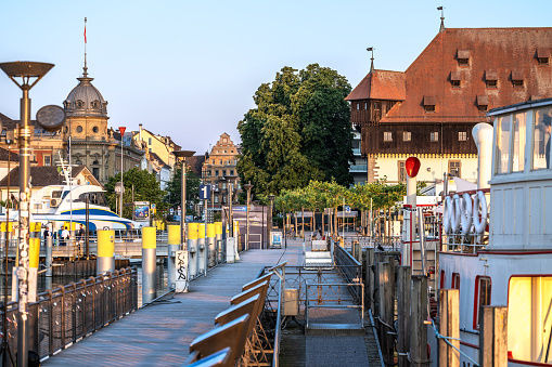 Description: View from the jetty to the market square at sunrise. Constance, Lake Constance, Baden-Württemberg, Germany, Europe.