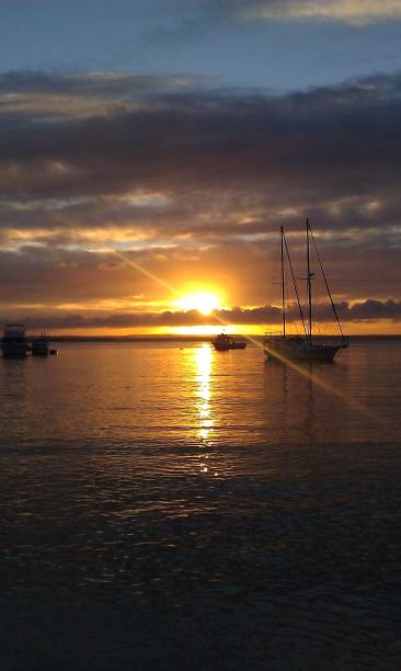 istock Boat in the horizon during a sunset 2148641491
