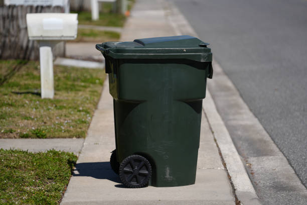 istock trash recycling bin out on the sidewalk on a sunny day 2148642715
