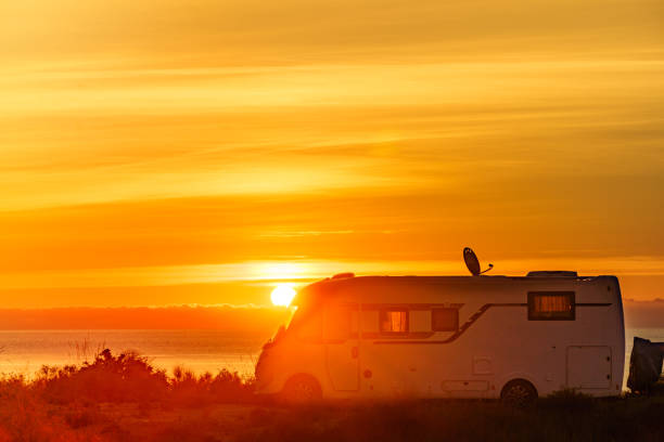 istock Caravan on sea at sunrise. 2148642904