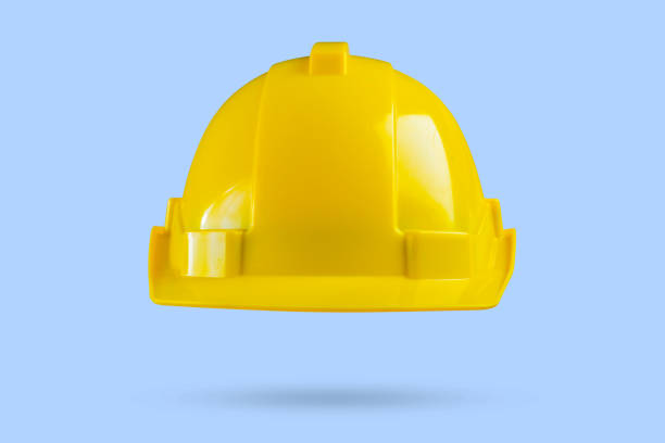 istock Yellow safety construction helmet on blue background 2148643342