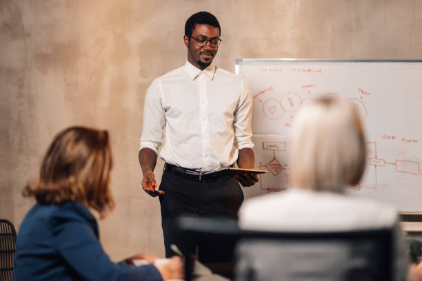 istock Interracial manager presenting business strategy at conference room. 2148643652