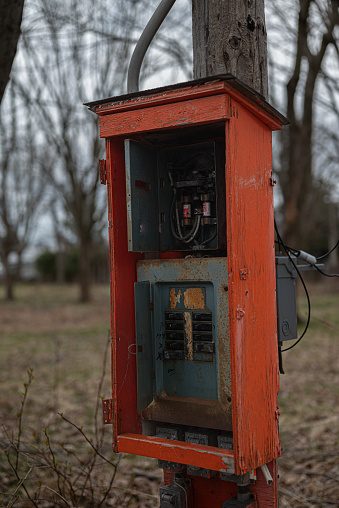 electric junction box in a wooden enclosure in an  abandonned camping lot