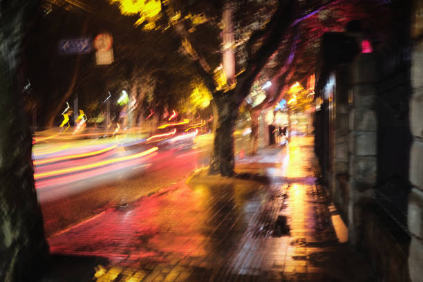 Blurred motion, vibrant light trails of traffic moving through downtown Shanghai