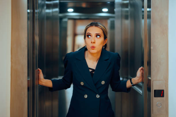 istock Surprised Businesswoman Entering an Elevator Feeling Anxious 2148648133