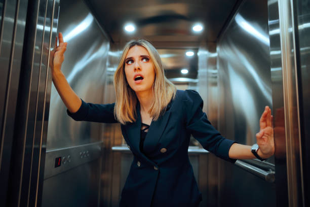 istock Stressed Businesswoman Feeling Uncomfortable and Anxious in Elevator 2148648134