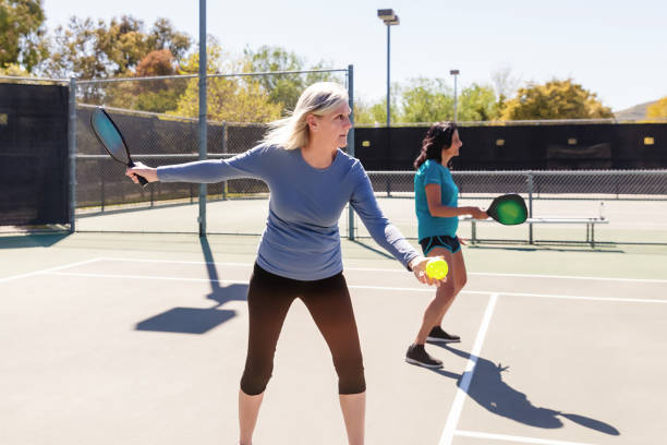 istock Senior women playing pickleball 2148649628
