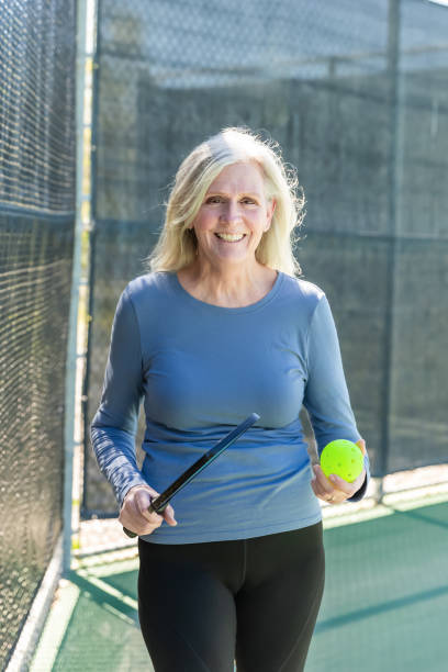 istock Senior woman playing pickleball 2148649719