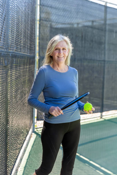 istock Senior woman playing pickleball 2148649734