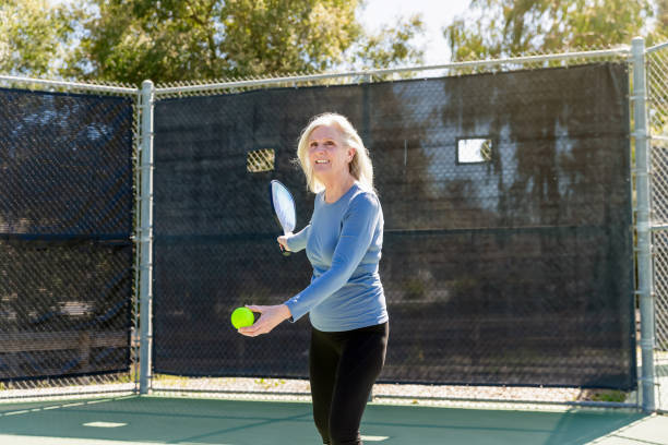 istock Senior woman playing pickleball 2148649755