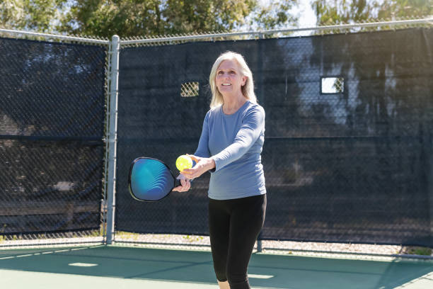 istock Senior woman playing pickleball 2148649787