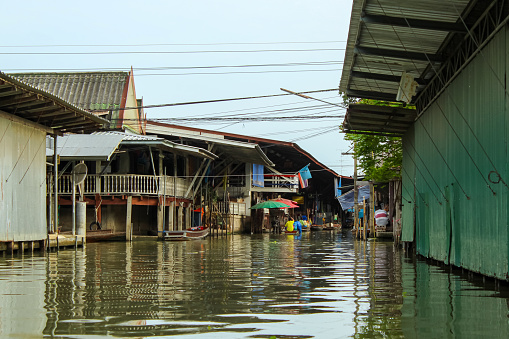 DAMNOEN SADUAK, THAILAND - April 19, 2020 : Lao-tuk-luck Floating Market is a oldest floating market In Damnoen Saduak, Ratchaburi Pronvince, Thailand. Shot on low season