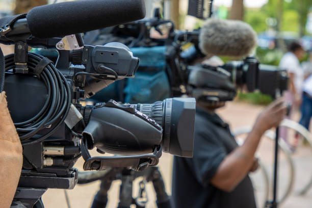 News camera during a press conference A television news camera set up for a press conference. press conference stock pictures, royalty-free photos & images