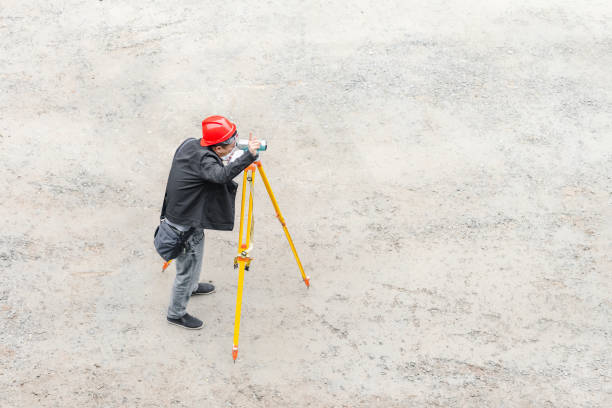 On a sunny day on March 16, 2024, in Shuangliu District, Chengdu, Sichuan Province, a middle-aged male worker was conducting road survey at the construction site