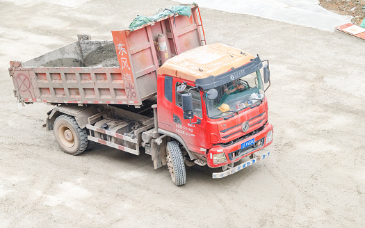 On a sunny day on April 6, 2024, a large truck was transporting stones at the construction site in Shuangliu District, Chengdu, Sichuan Province