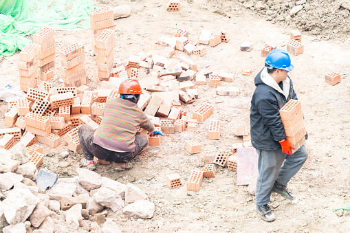 On a sunny day on March 4, 2024, in Shuangliu District, Chengdu, Sichuan Province, young female workers and young men were carrying bricks at the construction site