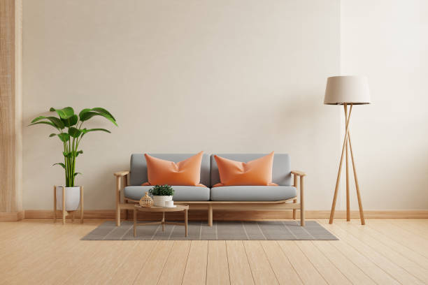 istock Modern minimalist interior with gray sofa on empty cream color wall background- 3D rendering 2148655523