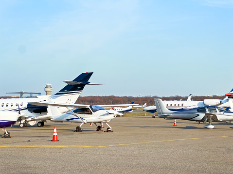 Private jets side by side in airport