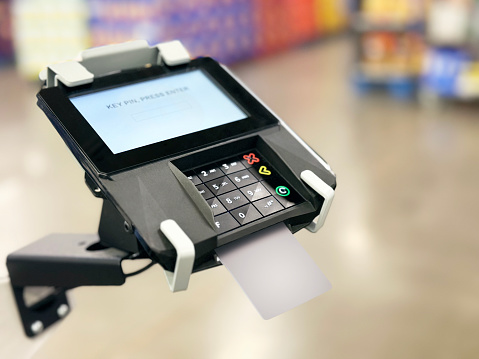Credit card reader at a cash Register in a supermarket
