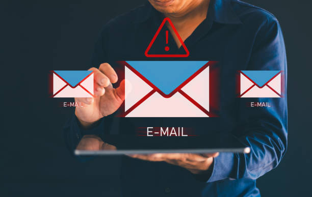 Men's hands use tablets, with email icons, spam, spam links, viruses, email icons, themes, holographic technology, and virtual screens of smartphone hackers.