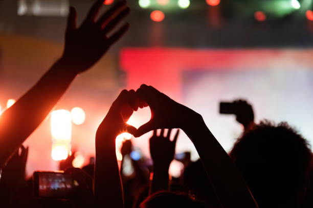 istock Hands making heart shape at music festival 2148659746