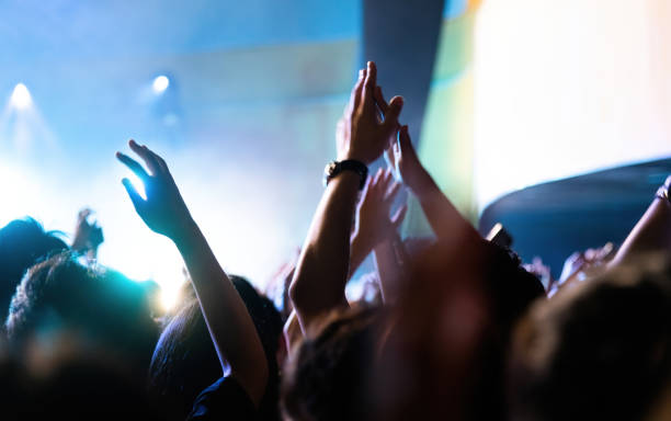 istock People clapping hands at music festival 2148659793