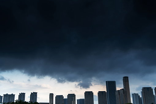 Dark stormy clouds over apartment buildings