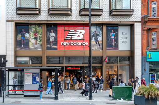 London, UK - March, 23, 2024 : New Balance retail store and brand logo. New Balance, is one of the world's major sports footwear and apparel manufacturers.