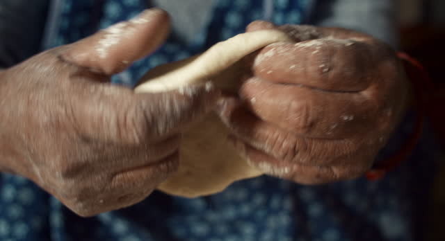 Closeup of Elderly Woman Making Traditional Dough