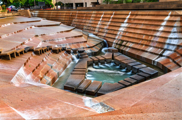 Gerald D. Hines Waterwall Park with skyscrapers in the background, Houston, Texas.