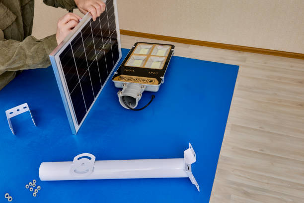istock LED street light with solar panel mounted on bracket holder, green technology for street lighting . 2148663490