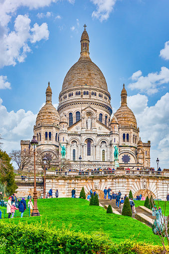 Paris,Prance-March 19,2024: Peoples walking in Sacre Coeur temple. Magnificent, gorgeous Paris in early spring.